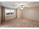 Neutral bedroom with carpet, a window with plantation shutters and a ceiling fan at 3932 S Crosscreek Dr, Chandler, AZ 85286