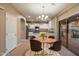 Kitchen with an island, granite countertops, stainless steel appliances, and sliding glass doors to backyard with dining table at 3932 S Crosscreek Dr, Chandler, AZ 85286