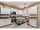 Bright kitchen with an island, granite countertops, and stainless steel appliances at 3932 S Crosscreek Dr, Chandler, AZ 85286
