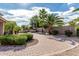 Landscaped backyard featuring a brick patio, mature landscaping, and outdoor grilling area at 4336 W Hackamore Dr, Phoenix, AZ 85083