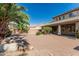 Beautiful backyard with expansive brick patio, mature landscaping, fire pit, and outdoor grilling area at 4336 W Hackamore Dr, Phoenix, AZ 85083