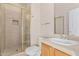 Tiled bathroom featuring a shower, toilet, and vanity with a sink, alongside gold hardware at 4336 W Hackamore Dr, Phoenix, AZ 85083