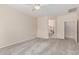 Large bedroom with neutral carpet and ceiling fan, leading to the bathroom with a vanity at 4336 W Hackamore Dr, Phoenix, AZ 85083