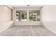 Bedroom with neutral carpet and paint featuring large windows with a view of the backyard at 4336 W Hackamore Dr, Phoenix, AZ 85083