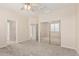 Bedroom with neutral walls and carpet plus closet with mirrored sliding doors at 4336 W Hackamore Dr, Phoenix, AZ 85083
