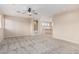 Open bonus room featuring neutral carpet and wall color, with stairway and view to the floor below at 4336 W Hackamore Dr, Phoenix, AZ 85083