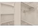 Walk-in closet with multiple shelves and clothing rods in a spacious bedroom at 4336 W Hackamore Dr, Phoenix, AZ 85083