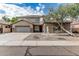 Charming home featuring a spacious three-car garage, stone accents, desert landscaping, and tile roof at 4336 W Hackamore Dr, Phoenix, AZ 85083