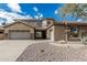 Charming home featuring a spacious three-car garage, stone accents, desert landscaping, and tile roof at 4336 W Hackamore Dr, Phoenix, AZ 85083