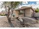 Home with stone accents, desert landscaping, and tile roof at 4336 W Hackamore Dr, Phoenix, AZ 85083