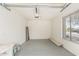 Clean garage space with overhead lighting, with room for storage and a workbench, plus a single window at 4336 W Hackamore Dr, Phoenix, AZ 85083