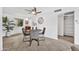 Open-concept dining area featuring a ceiling fan and tile floors, adjacent to kitchen and living areas at 4354 N 82Nd St # 167, Scottsdale, AZ 85251