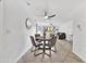 Open-concept dining area featuring a ceiling fan and views into the brightly lit living area with access to the patio at 4354 N 82Nd St # 167, Scottsdale, AZ 85251