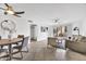 Open-concept living room with a ceiling fan, tile floors, and access to the patio with views of the community at 4354 N 82Nd St # 167, Scottsdale, AZ 85251