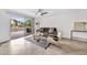 Bright living room with access to the patio, featuring a comfortable sofa, accent chair, and modern decor at 4354 N 82Nd St # 167, Scottsdale, AZ 85251