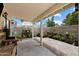 Enclosed backyard patio with a covered area and space for gardening or outdoor furniture, perfect for relaxation and entertainment at 441 S Maple -- # 83, Mesa, AZ 85206