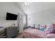 Bright bedroom features large window, ceiling fan, vaulted ceiling, and fun decor at 441 S Maple -- # 83, Mesa, AZ 85206