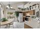 Modern kitchen with backyard view, featuring white appliances, a breakfast bar, and ample counter space for meal preparation at 441 S Maple -- # 83, Mesa, AZ 85206
