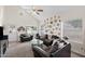 Well-lit living room with vaulted ceiling, comfortable seating, and large windows offering a welcoming and bright atmosphere at 441 S Maple -- # 83, Mesa, AZ 85206