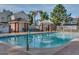 Inviting community pool with shaded seating areas, surrounded by lush landscaping and well-maintained grounds at 441 S Maple -- # 83, Mesa, AZ 85206
