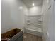 Bright bathroom with a tub shower combo and a gray vanity at 47451 W Kenner Dr, Maricopa, AZ 85139
