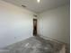 A bright bedroom with a window and door at 47451 W Kenner Dr, Maricopa, AZ 85139