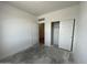 Bright bedroom featuring a sliding door closet and fresh white walls at 47451 W Kenner Dr, Maricopa, AZ 85139