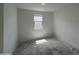 A minimalistic bedroom with a window and clean white walls ready for personalization at 47451 W Kenner Dr, Maricopa, AZ 85139
