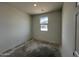 A simple bedroom with a window offering natural light at 47451 W Kenner Dr, Maricopa, AZ 85139