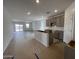 A modern, open kitchen with gray cabinets at 47451 W Kenner Dr, Maricopa, AZ 85139