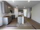 View of the kitchen with a gray central island at 47451 W Kenner Dr, Maricopa, AZ 85139