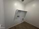 A laundry room with storage shelves at 47451 W Kenner Dr, Maricopa, AZ 85139