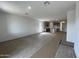 A spacious open-concept living room and kitchen at 47451 W Kenner Dr, Maricopa, AZ 85139
