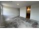A large living room with access to the kitchen at 47451 W Kenner Dr, Maricopa, AZ 85139