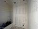 A bathtub with shower head, awaiting finishing touches at 47719 W Kenner Dr, Maricopa, AZ 85139