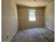 Bright bedroom with a window offering natural light and a view of the neighborhood at 47719 W Kenner Dr, Maricopa, AZ 85139