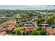 Expansive aerial view of a desert community featuring lush green lawns, mature trees and a community pool at 4901 E Kelton Ln # 1052, Scottsdale, AZ 85254
