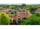 Breathtaking aerial view of a desert neighborhood featuring Spanish tile roofs, mature trees and community amenities at 4901 E Kelton Ln # 1052, Scottsdale, AZ 85254