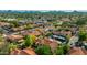 Wide aerial view of a stunning desert community featuring Spanish tile roofs, lush landscaping and mountain views at 4901 E Kelton Ln # 1052, Scottsdale, AZ 85254