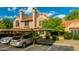 Inviting townhome with covered parking, mature landscaping, and a cozy front entrance at 4901 E Kelton Ln # 1052, Scottsdale, AZ 85254