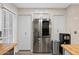 Kitchen featuring stainless steel refrigerator, white cabinets, and butcher block countertops at 4901 E Kelton Ln # 1052, Scottsdale, AZ 85254