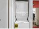 Laundry closet with stackable washer and dryer and an Energy Guide label at 4901 E Kelton Ln # 1052, Scottsdale, AZ 85254