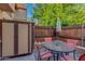 The quaint patio features a grill, shed, table, and four chairs at 4901 E Kelton Ln # 1052, Scottsdale, AZ 85254