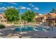 Community pool with lounge chairs, umbrellas and a nearby picnic area at 4901 E Kelton Ln # 1052, Scottsdale, AZ 85254