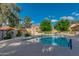 Enjoy the community pool surrounded by lush trees and comfortable lounge seating at 4901 E Kelton Ln # 1052, Scottsdale, AZ 85254