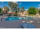 Relaxing community pool with lounge chairs and nearby lush shade trees at 4901 E Kelton Ln # 1052, Scottsdale, AZ 85254