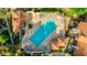 Aerial view of a large community pool with lounge chairs, surrounded by Southwestern architecture and mature landscaping at 4901 E Kelton Ln # 1052, Scottsdale, AZ 85254