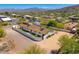 Aerial view showcasing mature trees and shrubs, against a mountain backdrop at 5801 E Surrey Dr, Cave Creek, AZ 85331