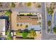 An aerial view shows a home with manicured landscaping, mature trees, and a mountain backdrop at 5801 E Surrey Dr, Cave Creek, AZ 85331