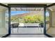 Balcony overlooking the valley with modern furniture and views, accessible via sliding glass doors at 5801 E Surrey Dr, Cave Creek, AZ 85331